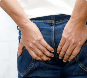 person with hemorrhoid pain